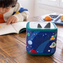 Decorative sleeve wrap for Toniebox 2 featuring a space theme with planets and rockets, placed next to a child reading.