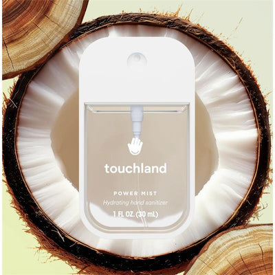 Touchland Beach Coco Power Mist Hydrating Hand Sanitizer in a clear bottle with a coconut background, 1 fl oz (30 mL).