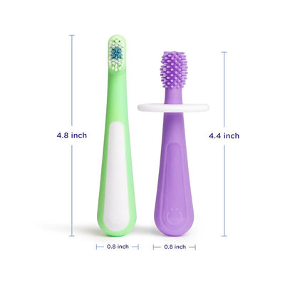 Two colorful toothbrushes in green and purple designed for babies and toddlers, featuring measurement indicators and training grips.