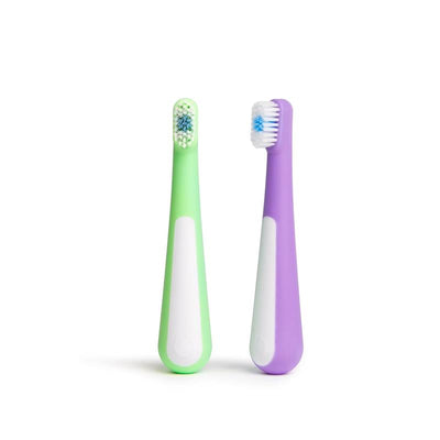 Toddler training toothbrush set featuring a green soft-bristled toothbrush and a purple gentle toothbrush.
