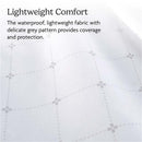 Waterproof UPPAbaby mattress cover with a delicate grey floral pattern, designed for Remi V2 Playard, offering protection.