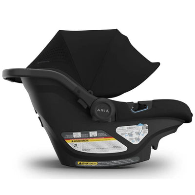 Lightweight black Uppababy Aria V2 infant car seat with a canopy, featuring safety instructions on the side.