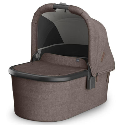 Uppababy Bassinet V3 in Owen color, featuring a mocha mélange fabric and carbon frame, designed for infant transportation.