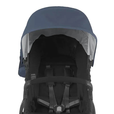 Uppababy Ridge stroller bumper bar with a navy canopy and black seat harness visible, designed for child safety and comfort.