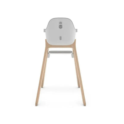 Highchair in Chloe Grey with a sleek design, featuring a soft gray seat and wooden legs, viewed from the back.