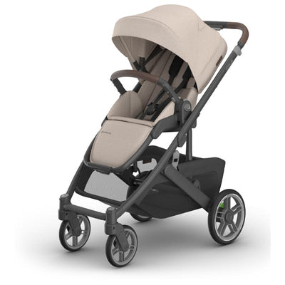 Uppababy Cruz V3 stroller in Sandstone Melange with Chestnut Leather accents, showcasing a sleek design and adjustable seat.