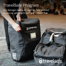 UPPAbaby G-Series Stroller Travel Bag with TravelSafe Program text, showing a person zipping the bag in an airport setting.