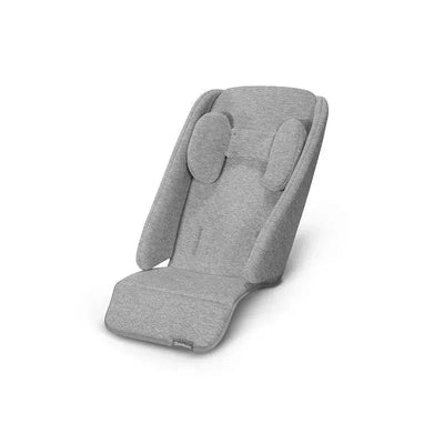 UPPAbaby Infant Snugseat in grey, featuring a soft, padded design with head support and a flat seat.