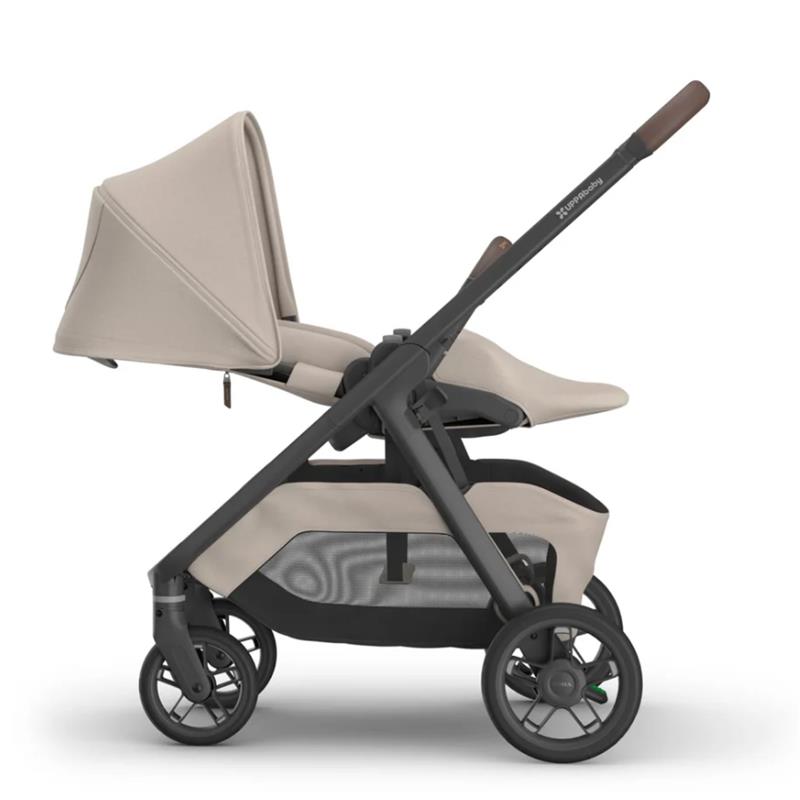 Uppababy Kona stroller in Sandstone Mélange, featuring a canopy, adjustable seat, and storage basket.