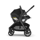 Uppababy Kona stroller with Aria V2 car seat in James Black, viewed from the side, showcasing its sleek design and safety features.