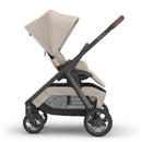 Uppababy Kona Stroller in Ada color (Sandstone Mélange), featuring a reclining seat, adjustable canopy, and sleek design.