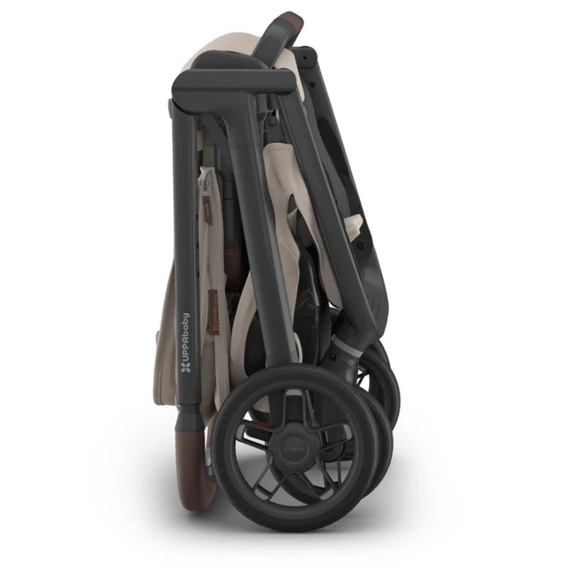 Uppababy Kona Stroller & Bassinet V3 Bundle in Ada (Sandstone Mélange), shown in a folded position with dark wheels.
