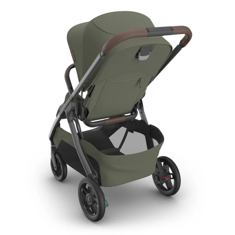 Uppababy Kona Stroller in Meadow Green with a modern design, showcasing a large storage basket and ergonomic handle.