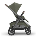 Uppababy Kona Stroller in Meadow Green with a reclining seat, adjustable canopy, and sleek frame design.