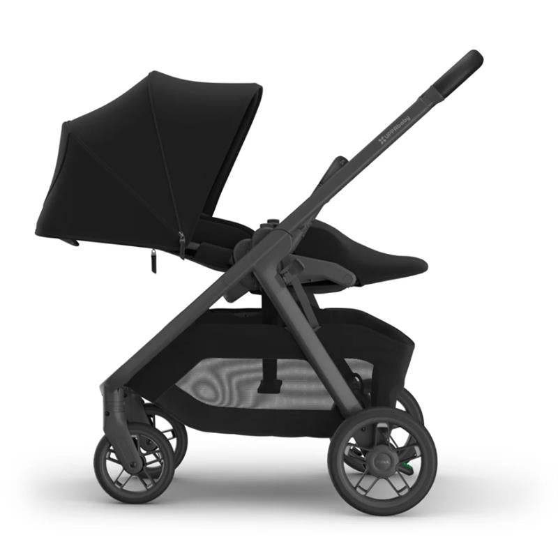Uppababy Kona Stroller & Bassinet V3 Bundle in black, featuring a canopy, a comfortable seat, and a storage basket.