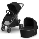 Uppababy Kona Stroller in black with bassinet, showcasing a sleek design and spacious seating for infants.