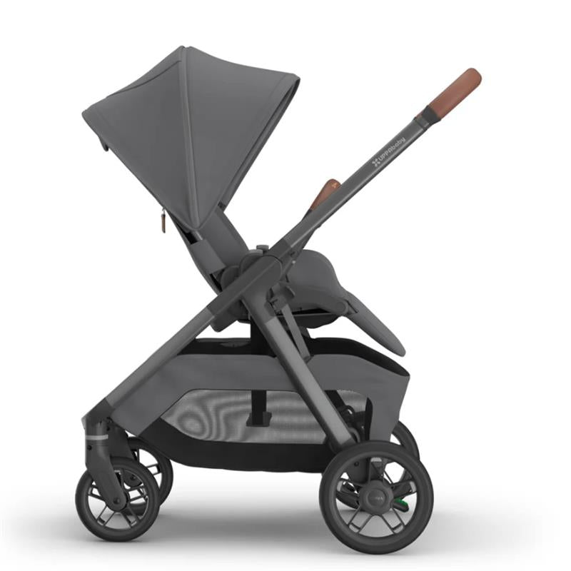Uppababy Kona Stroller in Rowan color, featuring a graphite frame, large sun canopy, and sleek design.