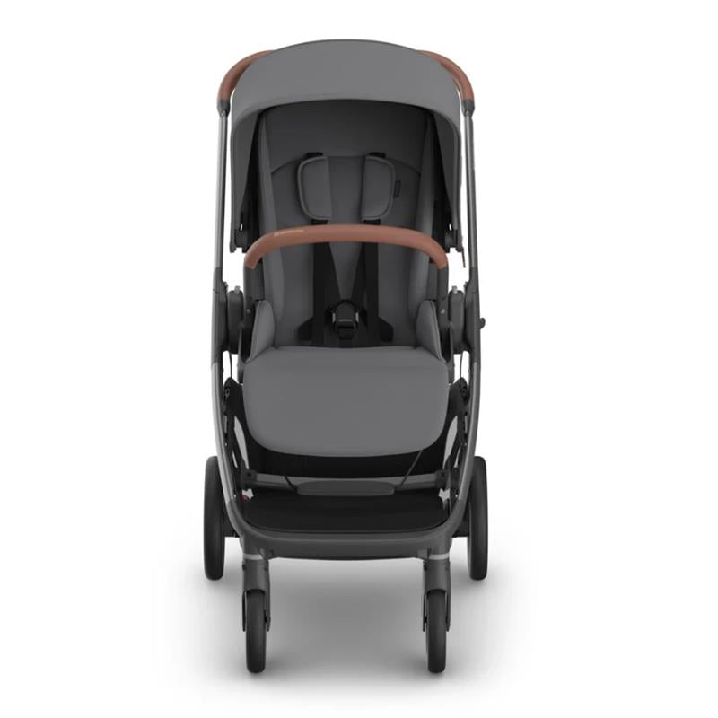 Uppababy Kona Stroller & Bassinet V3 Bundle in Rowan (Graphite), featuring a sleek gray design with a brown handlebar.
