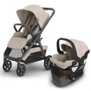 Uppababy Kona Stroller in sandstone mélange with a Mesa V3 infant car seat, both featuring a neutral color scheme and smooth design.
