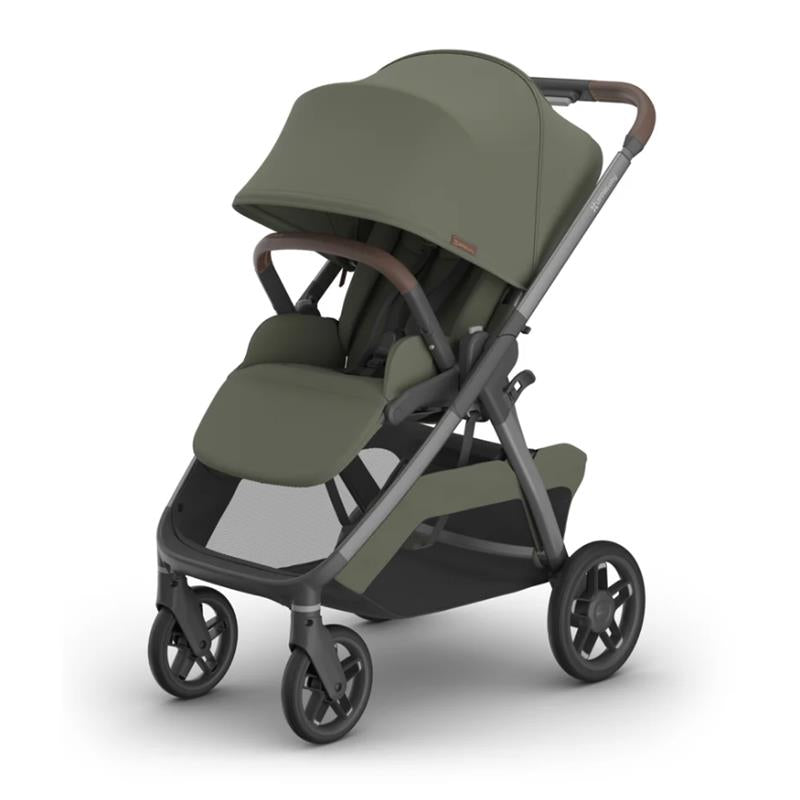 Uppababy Kona stroller in Meadow Green, featuring a spacious seat, protective canopy, and sleek frame design.