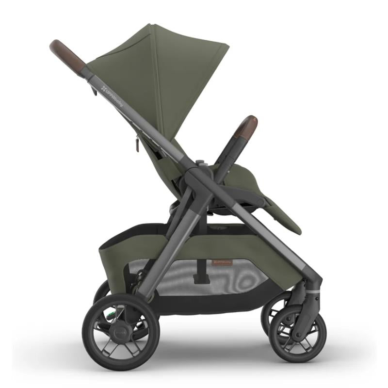 Uppababy Kona Stroller in Meadow Green with a reclining seat, adjustable canopy, and a sleek frame design.