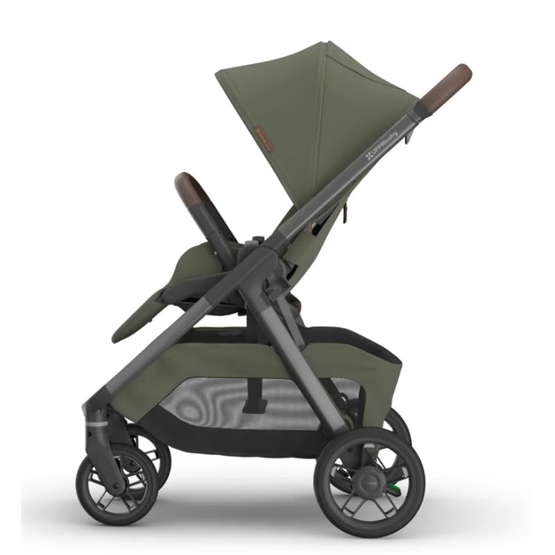 Uppababy Kona Stroller in Meadow Green with brown handle, showcasing a modern design and adjustable features.