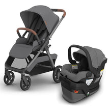 Uppababy Kona stroller in grey with brown leatherette handles beside Mesa V3 infant car seat in matching grey.