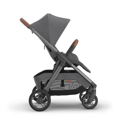 Uppababy Kona Stroller in Rowan, featuring a graphite frame, saddle leather accents, and a folding canopy.