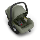 Uppababy Mesa V3 infant car seat in Meadow Green, featuring a removable canopy and secure harness system.