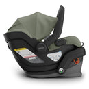 Uppababy Mesa V3 Infant Car Seat in Evelyn (Meadow Green) with a black base and safety instructions visible on the side.