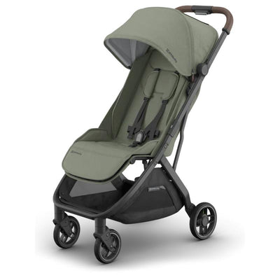 Uppababy Minu V3 stroller in Meadow Green with a carbon frame and chestnut leather handle, showcasing its compact design.