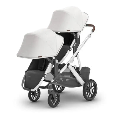 Uppababy RumbleSeat V2+ in Bryce, a double stroller with two canopies, adjustable seats, and a sleek white and gray design.