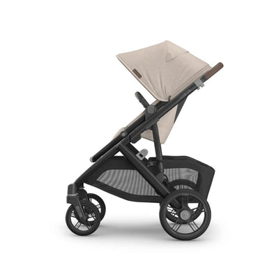 Uppababy Vista V3 stroller in Ada Sandstone Melange with chestnut leather accents, featuring a folding canopy and one rear wheel.