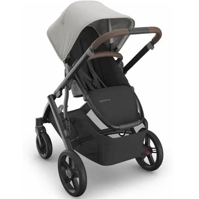 Uppababy Vista V3 stroller in black with a gray canopy and brown handlebar, designed for child transport.