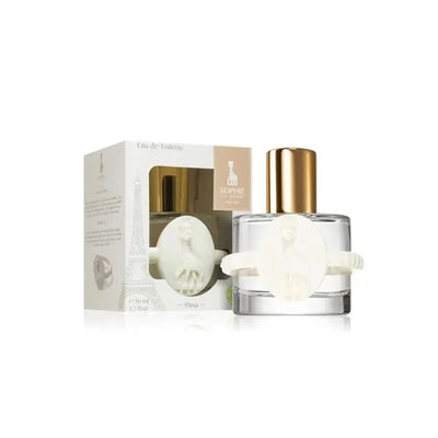 Vulli Sophie La Girafe Eau De Toilette bottle with a gold cap and a decorative white ring, alongside its packaging displaying Eiffel Tower design.