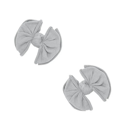 Two grey Baby Bling Bows fabric hair clips for babies on a white background