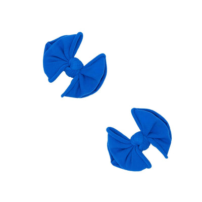 Two ocean blue Baby Bling Bows fabric hair clips for babies on a white background.