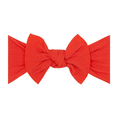 Poppy red knotted fabric baby headband bow by Baby Bling Bows