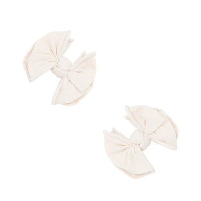 Two oatmeal colored Baby Bling Bows fabric hair clips for babies